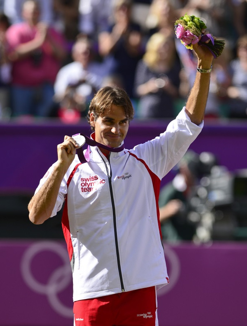 Roger Federer ganó la medalla de plata en individuales durante los juegos olímpicos del 2012. / AFP