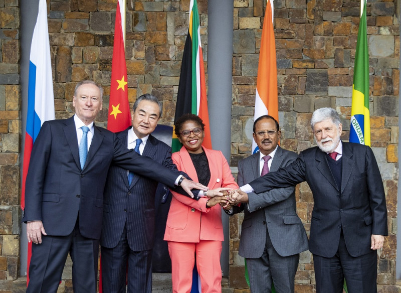 Wang Yi (2nd L), a member of the Political Bureau of the Communist Party of China (CPC) Central Committee and director of the Office of the CPC Central Commission for Foreign Affairs, poses for a group photo with Khumbudzo Ntshavheni (C), minister in the Presidency of South Africa, Celso Luiz Nunes Amorim (1st R), chief adviser of the Presidency of Brazil, Nikolai Patrushev (1st L), secretary of the Security Council of Russia, and National Security Adviser of India Ajit Doval (2nd R) at the 13th Meeting of BRICS National Security Advisers and High Representatives on National Security in Johannesburg, South Africa, July 25, 2023.