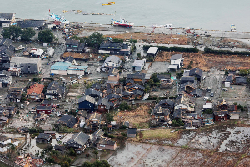 This aerial photo provided by Jiji Press shows damage in the city of Suzu, Ishikawa prefecture on January 2, 2024, a day after a major 7.5 magnitude earthquake struck the Noto region in Ishikawa prefecture. Japanese rescuers battled against the clock and powerful aftershocks on January 2 to find survivors of a major earthquake that struck on New Year's Day, killing at least 30 people and causing widespread destruction. (Photo by JIJI PRESS / AFP) / Japan OUT