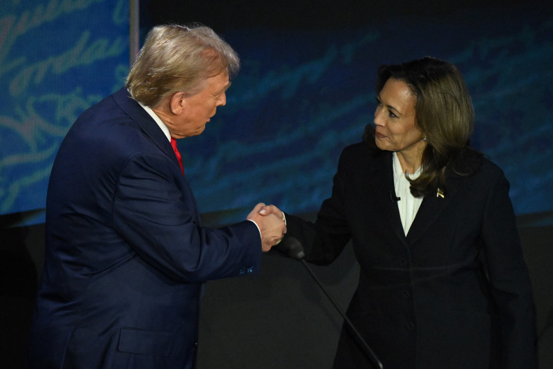 US Vice President and Democratic presidential candidate Kamala Harris and former US President and Republican presidential candidate Donald Trump shake hands at the start of a presidential debate at the National Constitution Center in Philadelphia, Pennsylvania, on September 10, 2024. (Photo by SAUL LOEB / AFP)