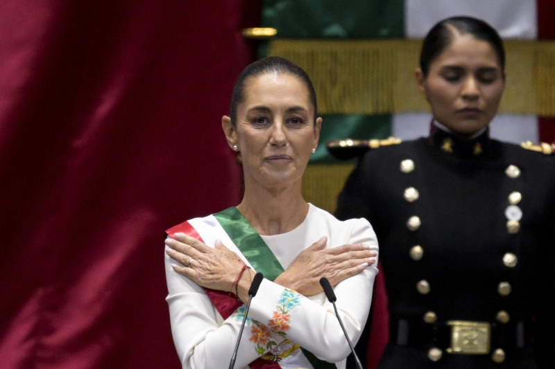 Mexico's new President Claudia Sheinbaum gestures after being sworn-in during the inauguration ceremony at the Congress of the Union in Mexico City on October 1, 2024. (Photo by Alfredo ESTRELLA / AFP)