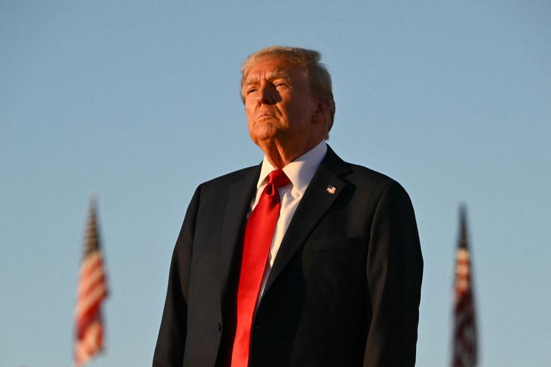 Former US President and Republican presidential candidate Donald Trump looks on during a campaign rally at site of his first assassination attempt in Butler, Pennsylvania on October 5, 2024. (Photo by Jim WATSON / AFP)