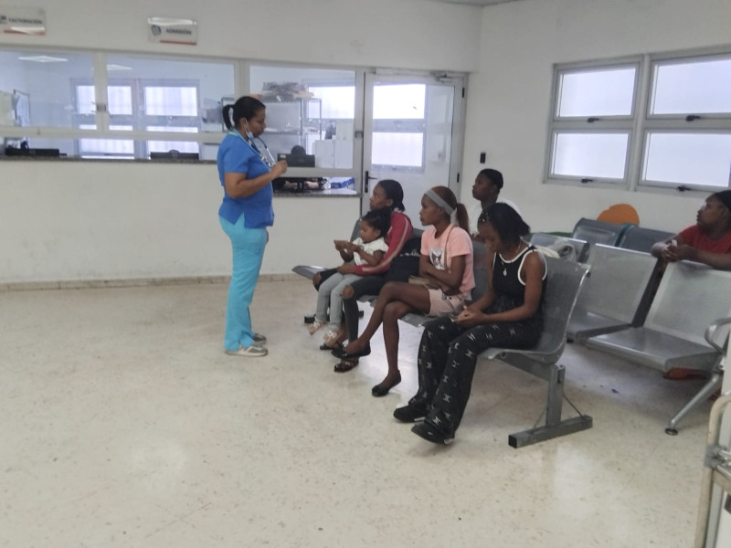 The doctor measures the temperature of patients in the Emergency Room waiting area.